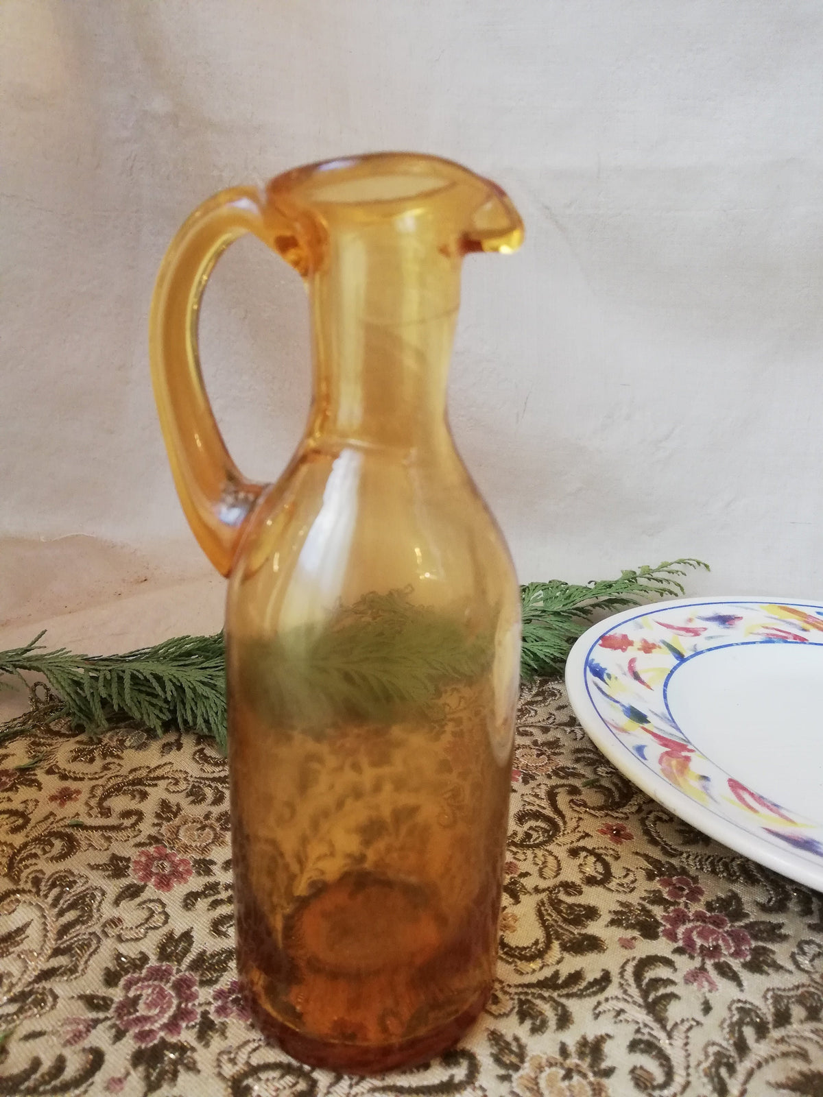 Two amber condiment bottles for oil and vinegar.