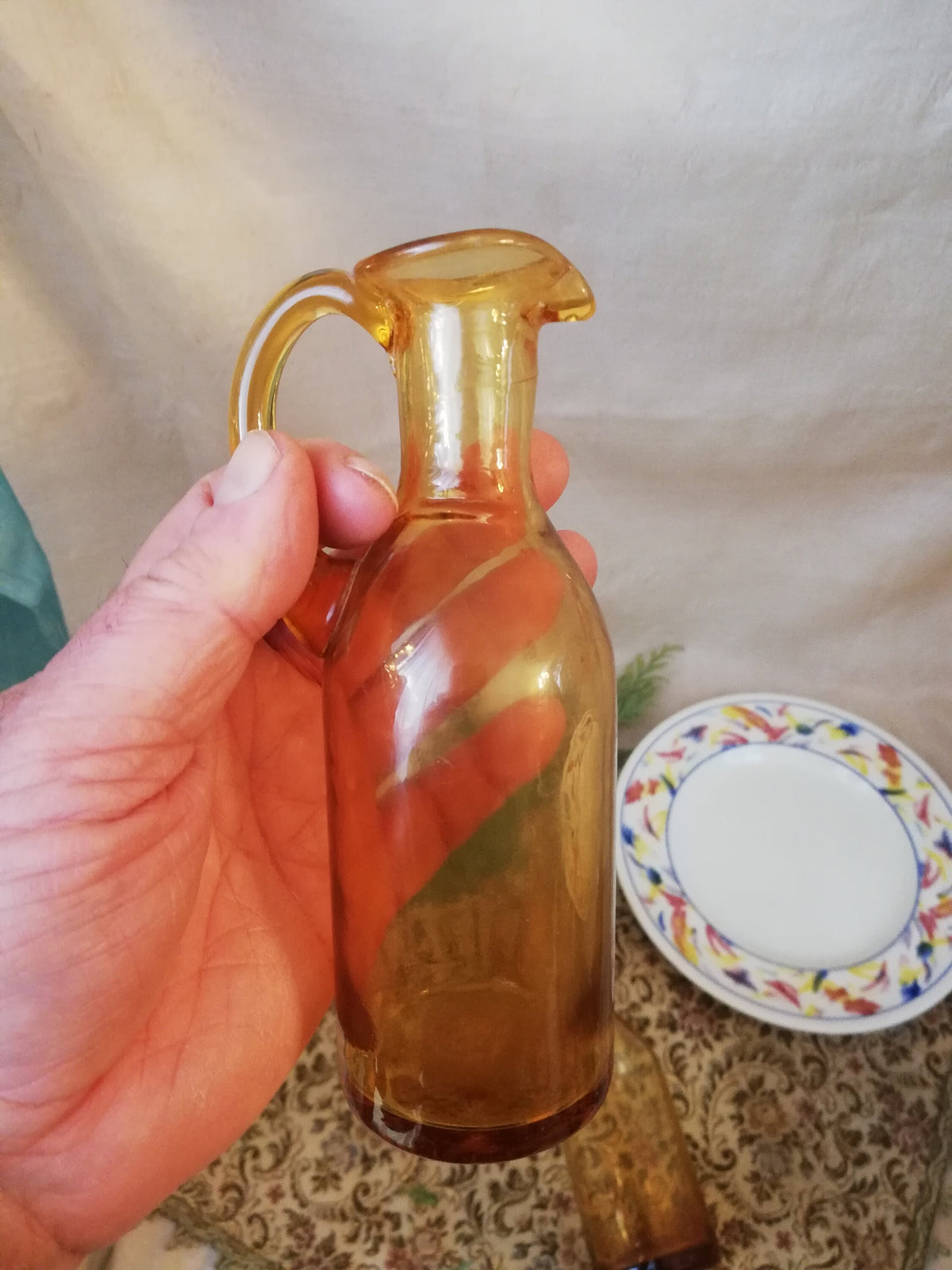 Two amber condiment bottles for oil and vinegar.