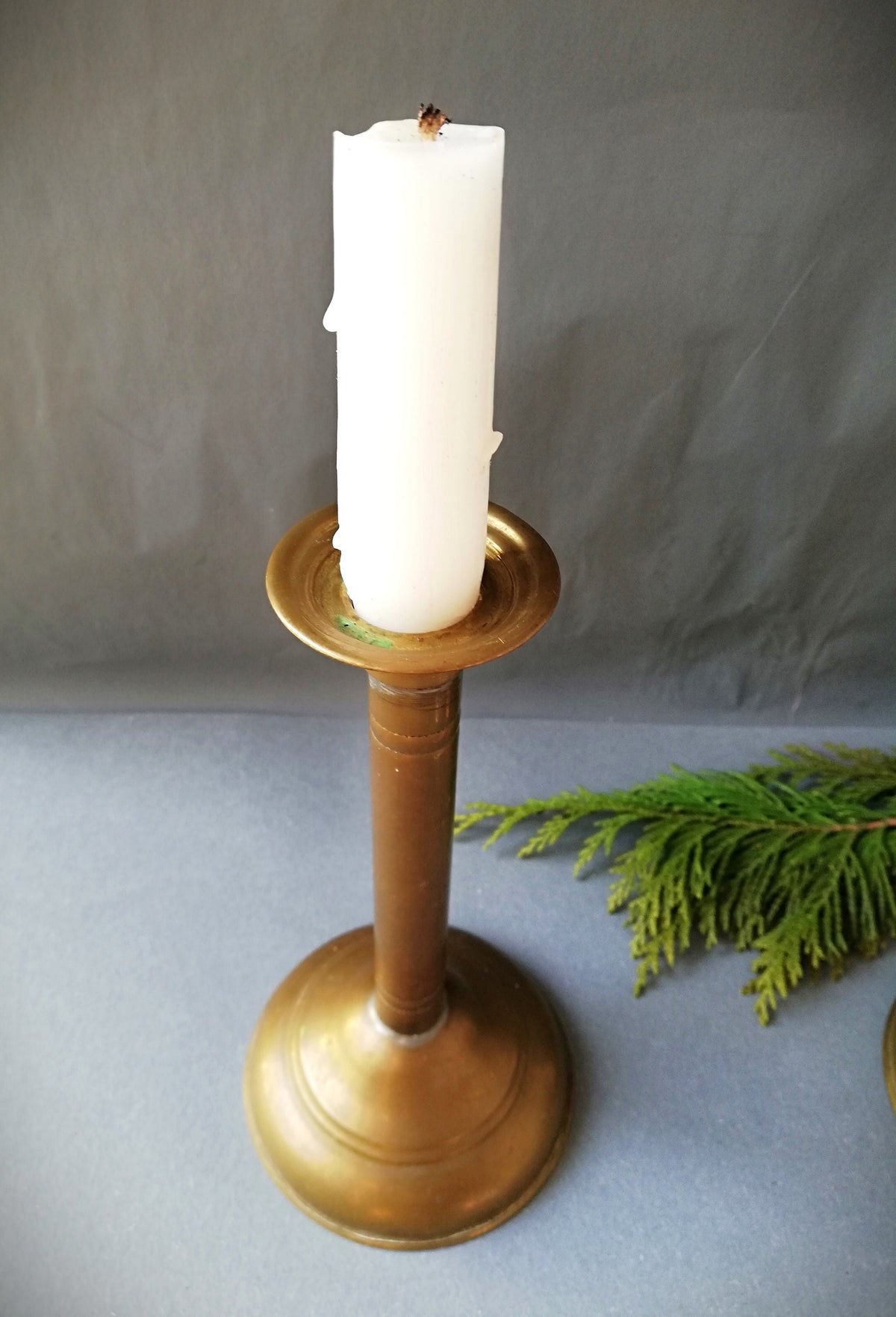 An antique brass candle holder, candle holder for a romantic dinner, candle lighting for romantic hours