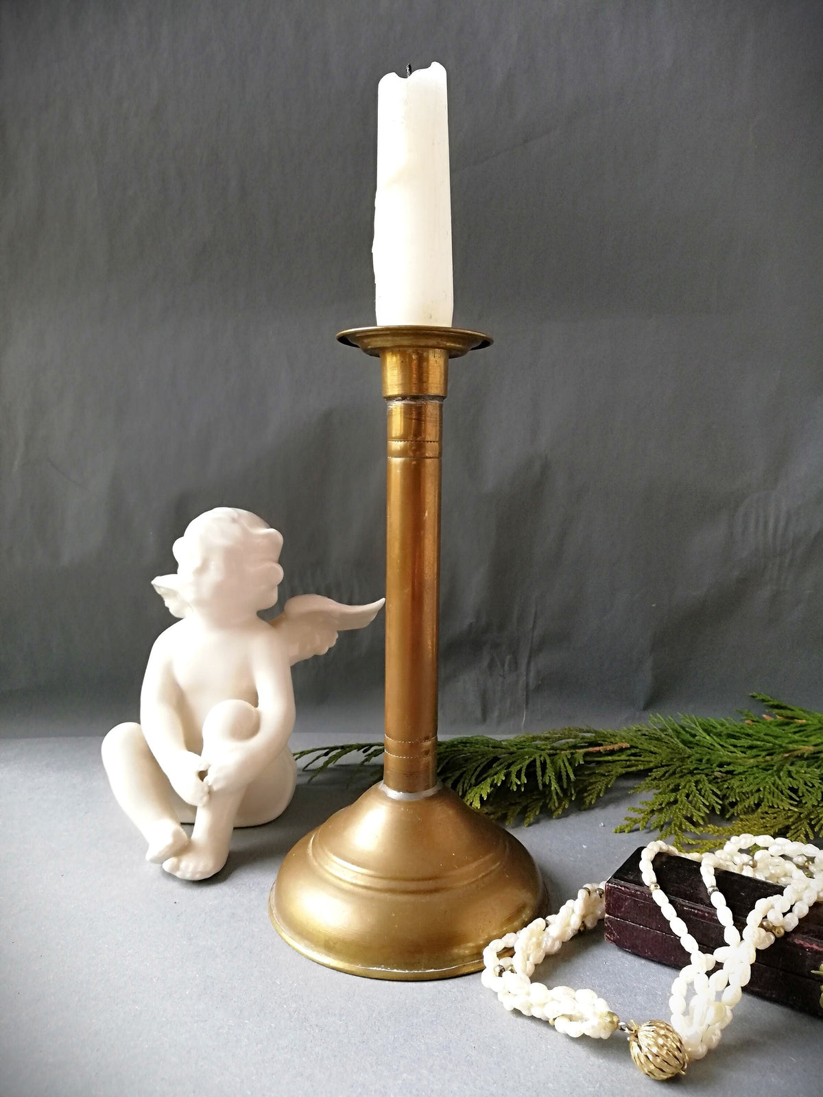 An antique brass candle holder, candle holder for a romantic dinner, candle lighting for romantic hours
