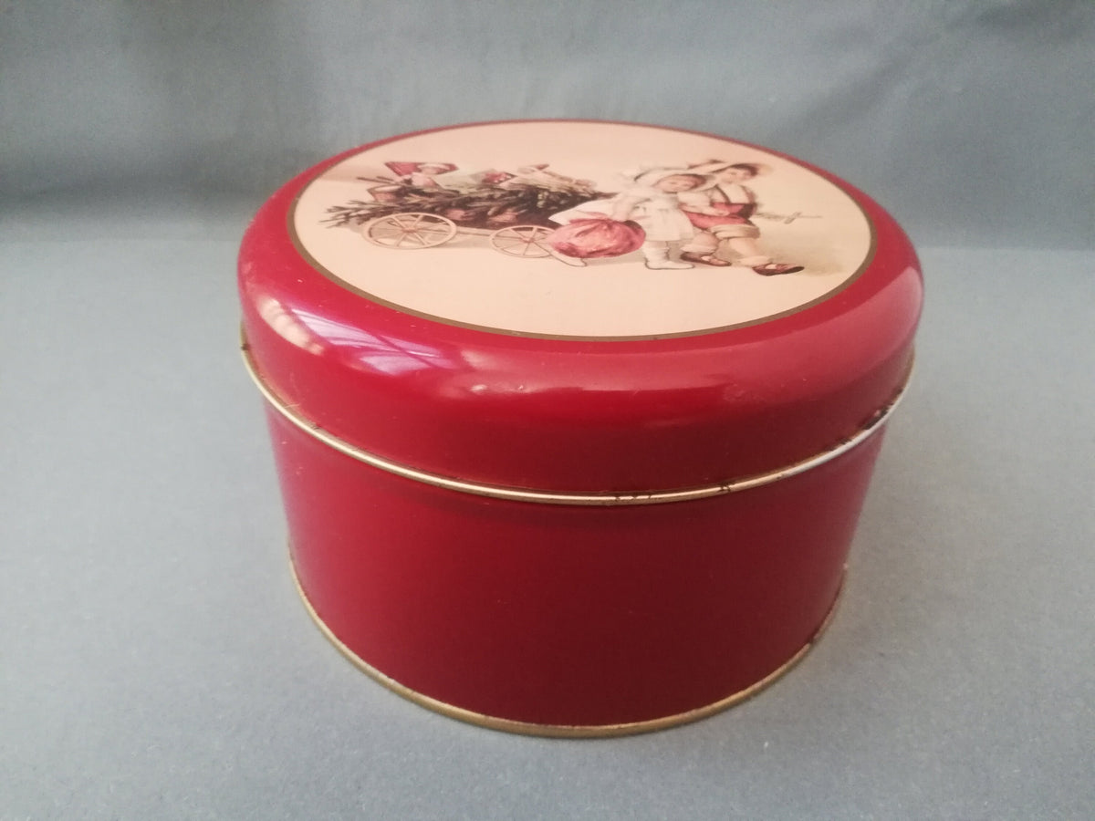 Red tin can with children playing, children pulling a cart with a Christmas tree and gifts, tin can for collectors, ,