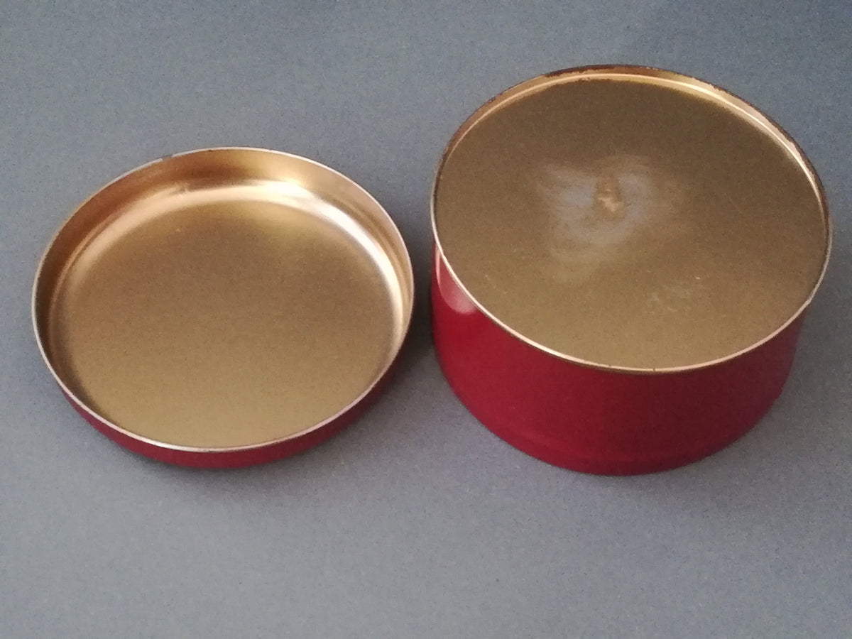 Red tin can with children playing, children pulling a cart with a Christmas tree and gifts, tin can for collectors, ,