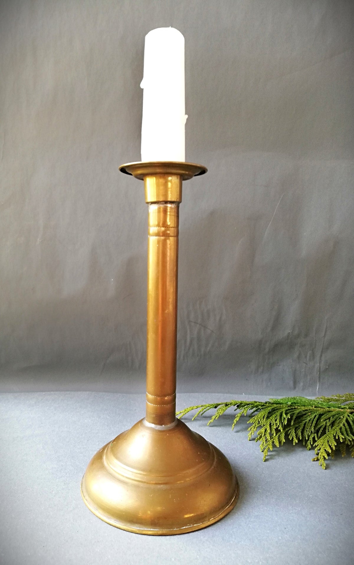 An antique brass candle holder, candle holder for a romantic dinner, candle lighting for romantic hours