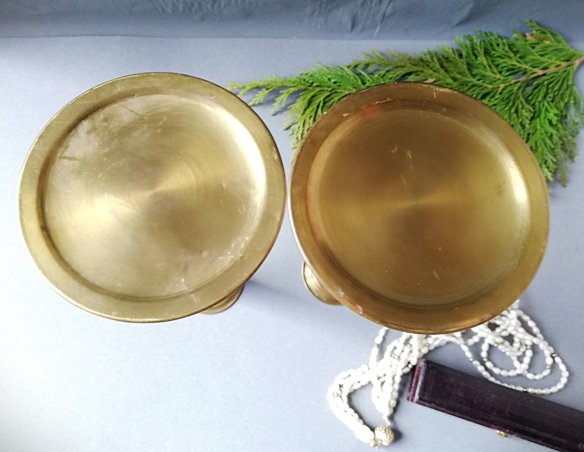 An antique brass candle holder, candle holder for a romantic dinner, candle lighting for romantic hours