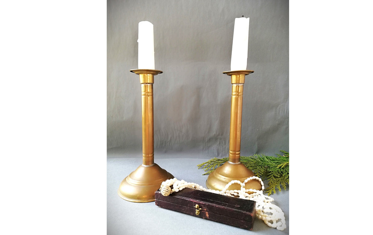 An antique brass candle holder, candle holder for a romantic dinner, candle lighting for romantic hours