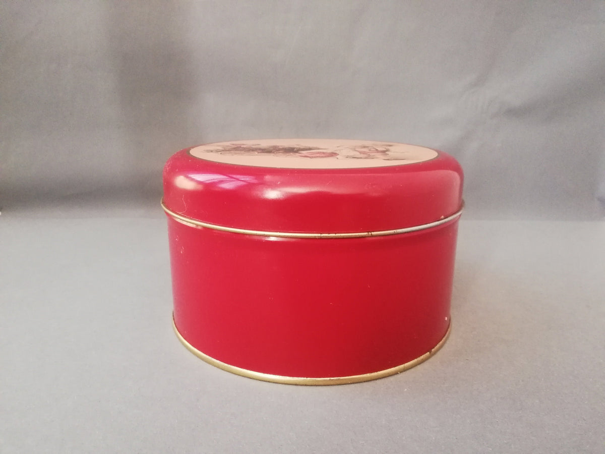Red tin can with children playing, children pulling a cart with a Christmas tree and gifts, tin can for collectors, ,