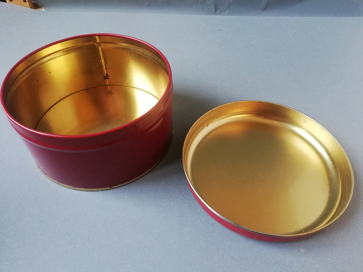 Red tin can with children playing, children pulling a cart with a Christmas tree and gifts, tin can for collectors, ,