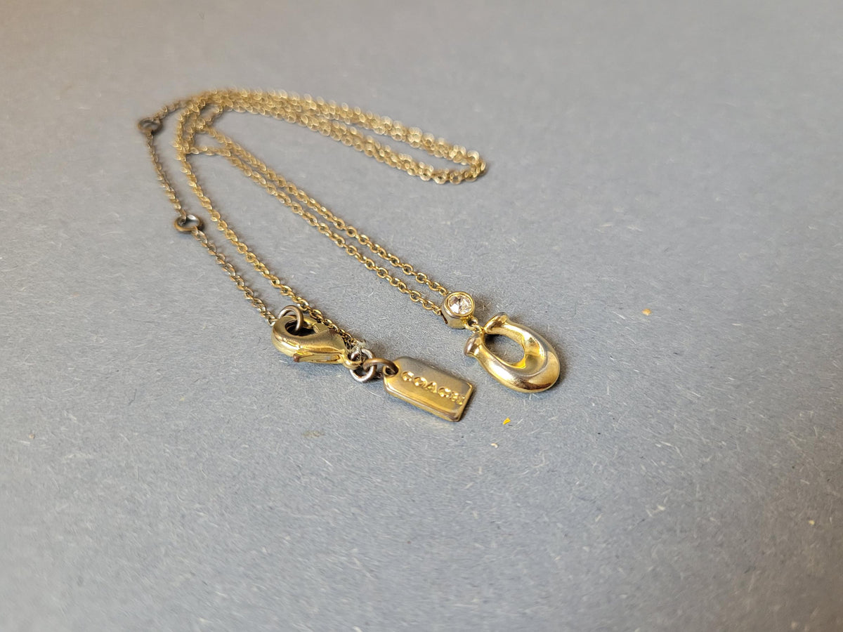 Goldfarbene Kette der Vintage Coach Halskette