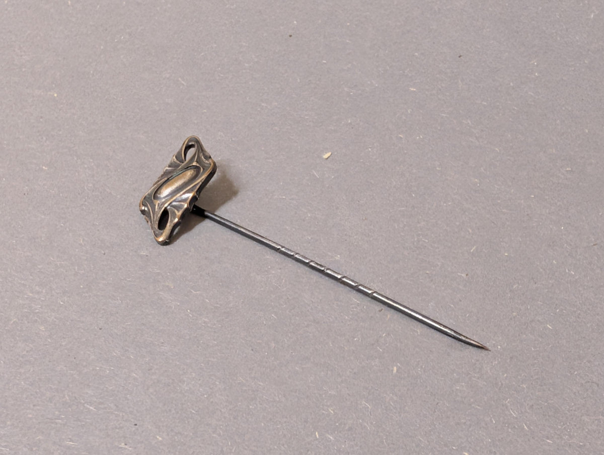 Ornamentaler Metallkopf im Jugendstil