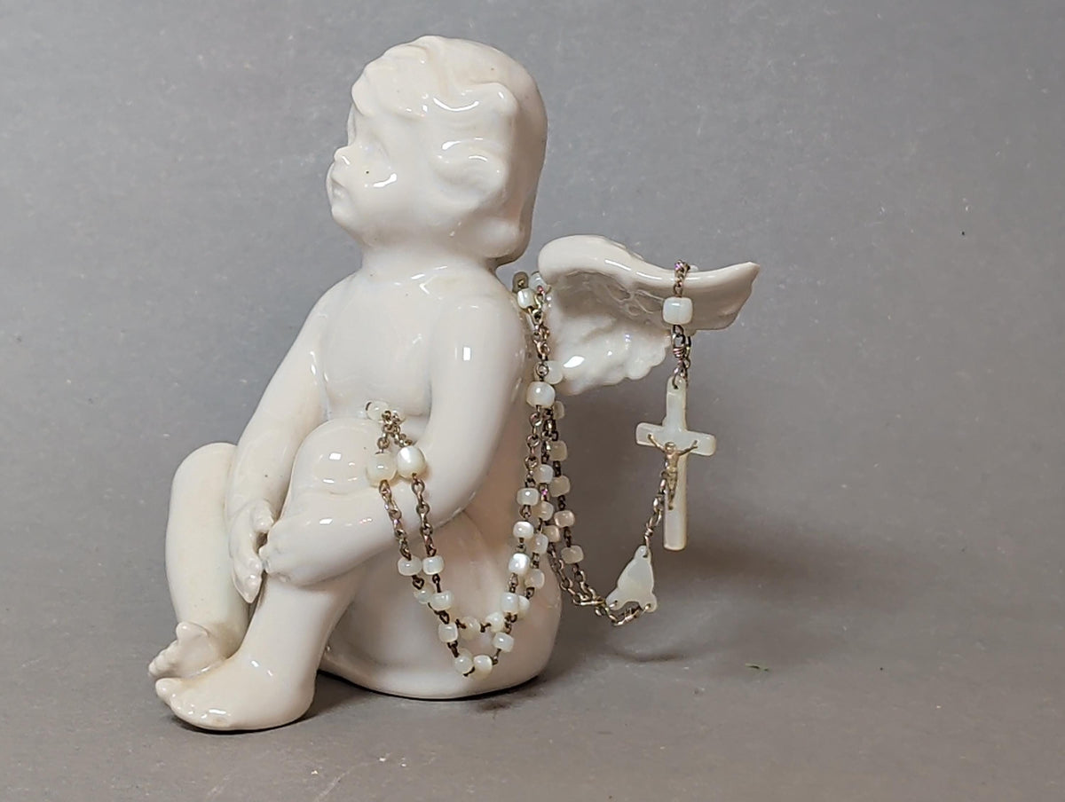 Rosenkranz in der Hand