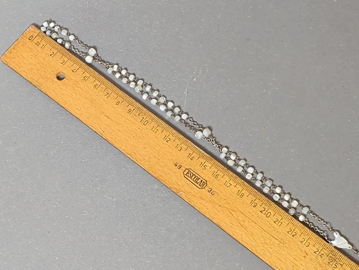 Rosenkranz als Kette getragen