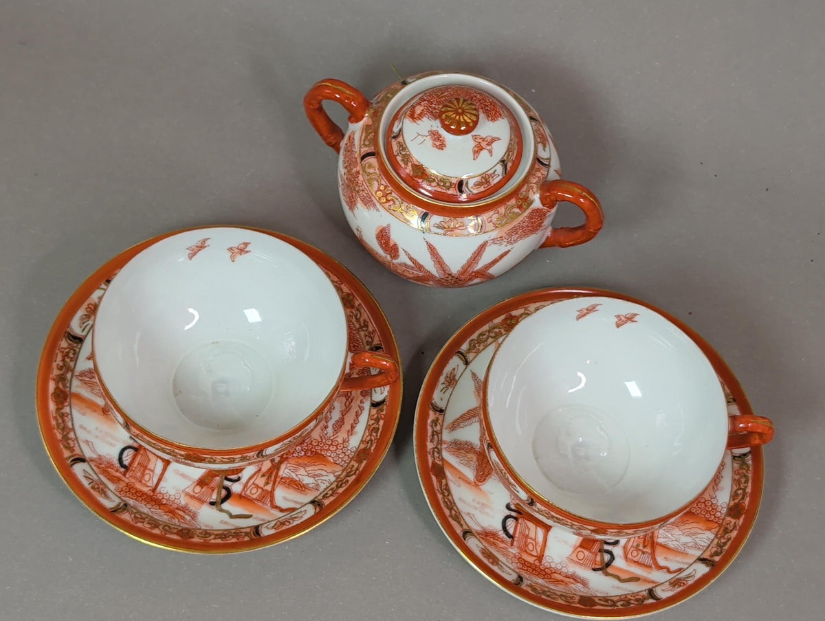 Teetasse mit Untertasse, handgemalt in Eisenrot und Gold