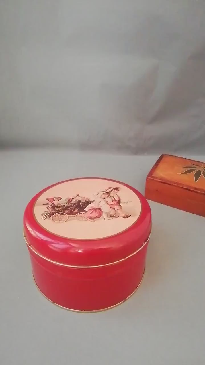 Red tin can with children playing, children pulling a cart with a Christmas tree and gifts, tin can for collectors, ,
